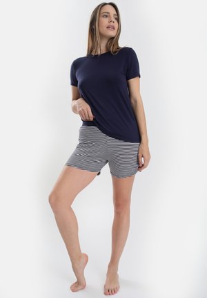 Navy short-sleeve top paired with striped shorts. Top is smooth, shorts feature white and navy horizontal stripes. Simple design, casual wear.
