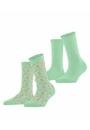 Deux paires de chaussettes mi-hautes vert menthe, une couleur unie et l'autre avec de petits motifs floraux roses et orange, toutes deux avec des bords festonnés.