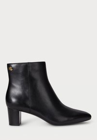 Black leather ankle boot with a pointed toe and a block heel. Features a gold logo detail on the back. Smooth texture with a sleek design.