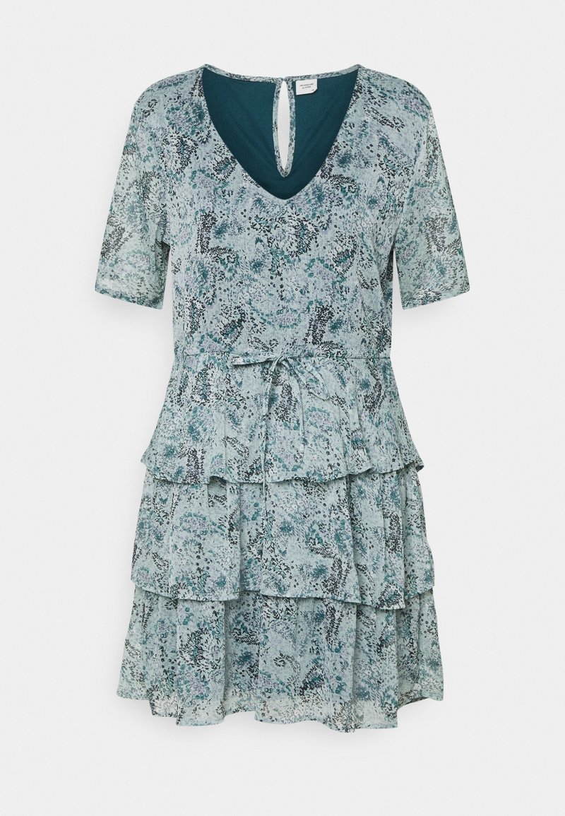 Tiered dress in a blue-green floral print, featuring a v-neckline, short sleeves, and a tie waist detail. Lightweight fabric with soft texture.