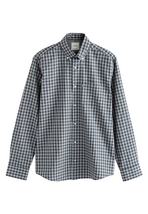 Camicia con bottoni in motivo a quadri blu navy, bianco e grigio. Presenta un colletto, maniche lunghe e un taschino sul petto. Materiale in cotone.