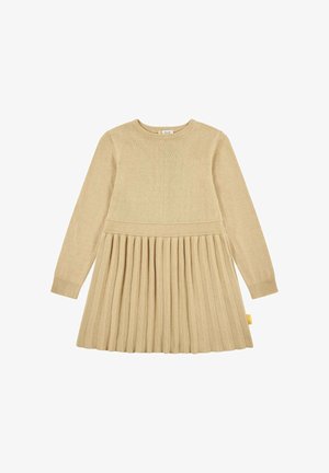 Abito lavorato a maglia beige con maniche lunghe, corpino a coste e gonna plissettata. Presenta un'etichetta gialla sul lato. Texture morbida e design aderente.