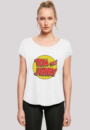 White short-sleeve t-shirt featuring a yellow circle graphic with red text "TOM and JERRY." Soft fabric with a relaxed fit and rounded neckline.