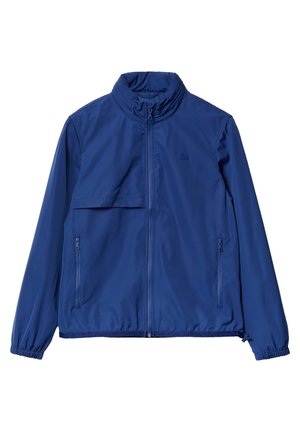 Blaue leichte Jacke mit Stehkragen, durchgehendem Frontreißverschluss, zwei seitlichen Reißverschlusstaschen und elastischen Bündchen.