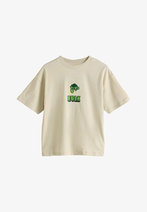 Beige kurzärmliges T-Shirt aus Baumwolle mit einem grünen Hulk-Motiv auf der Vorderseite und fettem Schriftzug. Rundhalsausschnitt, lockere Passform.