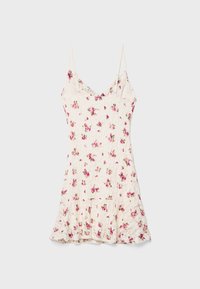 Robe mini fleurie à fines bretelles, avec un fond crème et de petits motifs de roses roses. Fabriquée en tissu léger et texturé.