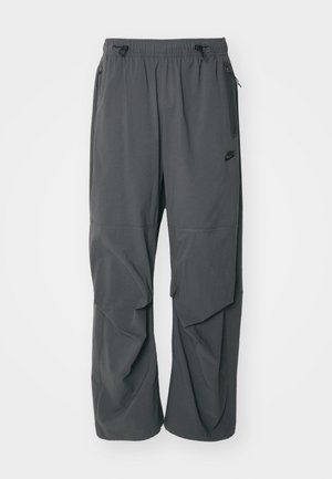 Nike Sportswear TECH WOVEN - Tracksuit bottoms - anthracite