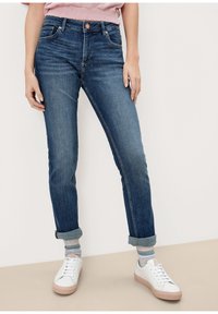 Mörkblå denimjeans med rak benpassform, med knapp- och dragkedjestängning, uppvikta fållar och detaljer på framfickorna.