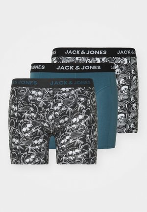 Three pairs of JACK & JONES boxer shorts: black with skull and palm print, teal, and patterned black with white graphics. Wide black waistbands.