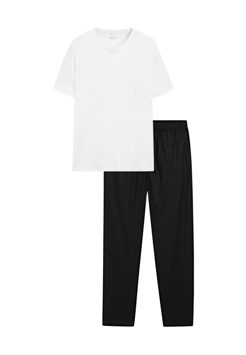 White cotton t-shirt with a round neck paired with black elastic waist sweatpants, showcasing a smooth texture and relaxed fit.