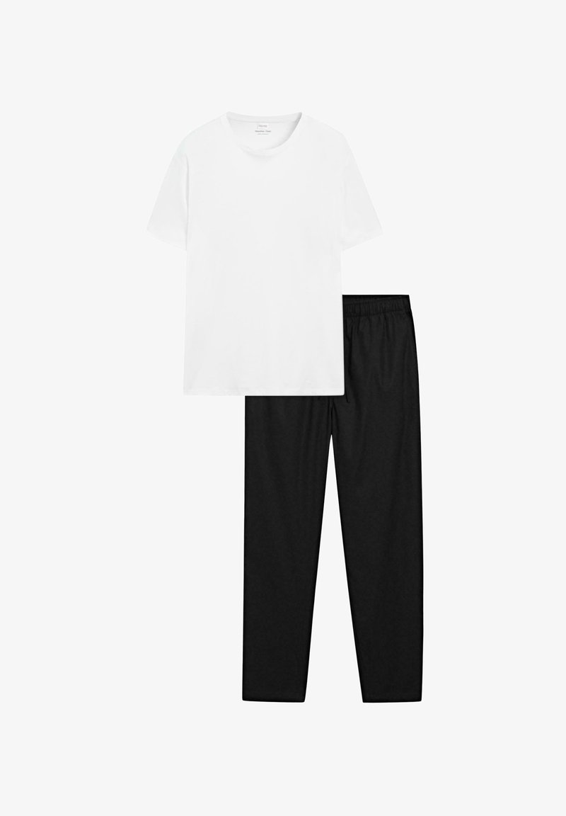 White cotton t-shirt with a round neck paired with black elastic waist sweatpants, showcasing a smooth texture and relaxed fit.