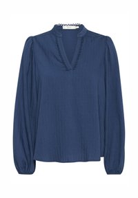 Blouse bleu marine à manches longues avec poignets froncés, encolure en V bordée de dentelle festonnée et motif subtil à texture verticale.
