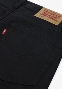 Levi's® 555 RELAXED WORK PANTS - Stoffhose - black