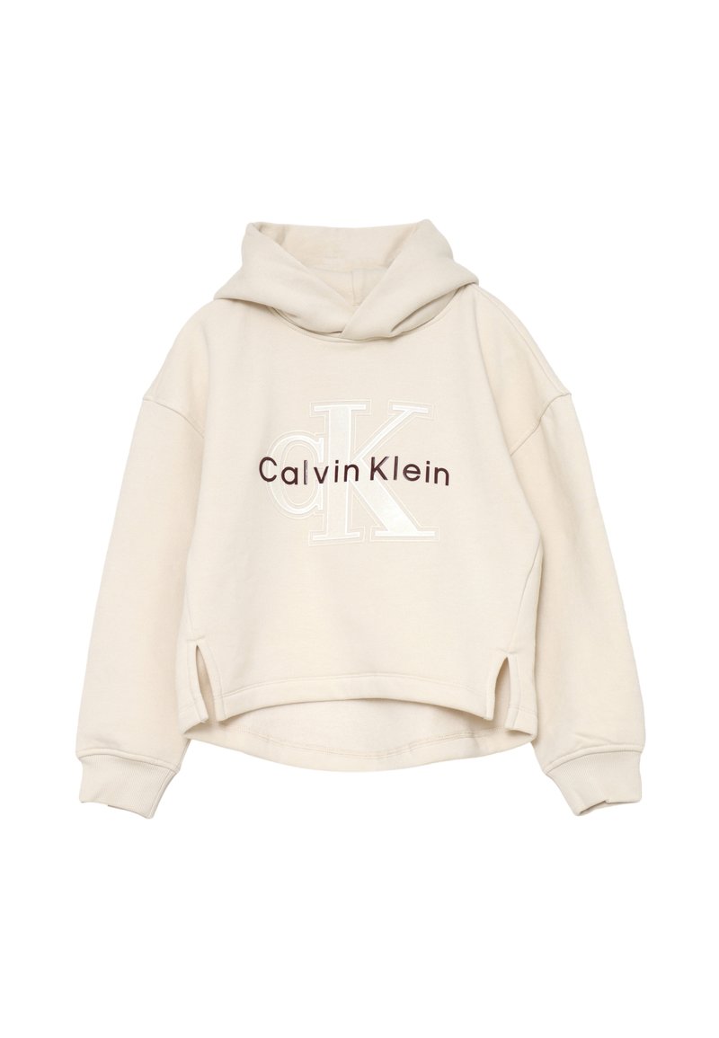Felpa cropped beige con cappuccio, maniche lunghe, spacchi laterali e logo "Calvin Klein" in marrone e bianco sul davanti.