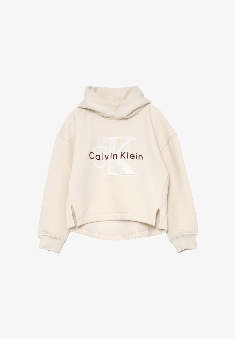 Felpa cropped beige con cappuccio, maniche lunghe, spacchi laterali e logo "Calvin Klein" in marrone e bianco sul davanti.
