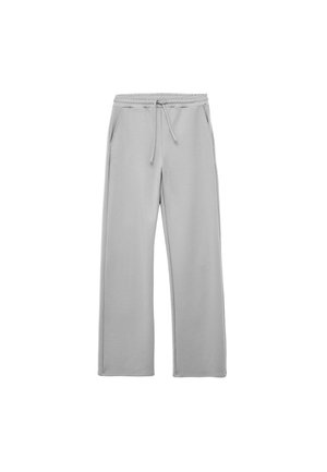 Lichtgrijze joggingbroek met een losse pasvorm, elastische tailleband, trekkoord en zijzakken. Gemaakt van zachte, gladde stof zonder patronen.