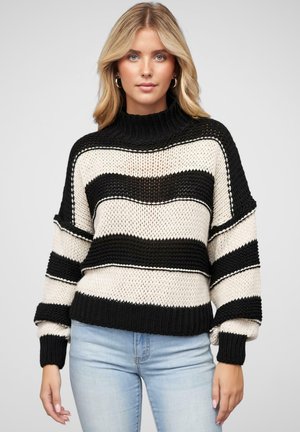 Pull en maille avec un motif rayé noir et crème. Dispose d'un col haut côtelé et de poignets côtelés. Coupe décontractée, tissu texturé.