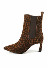 Leopard print ankle boot in brown suede with a pointed toe, elastic side panels, and a 3-inch stiletto heel. Textured fabric with brown accents.