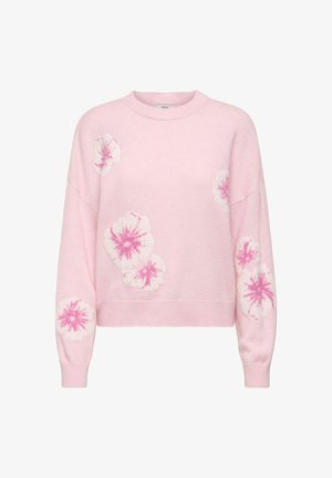 Roosa kootud sviiter, millel on lahtine istuvus, esitleb valgeid ja tumedamat roosat lillemotiivi varrukatel ja rinnas. Ribaga mansetid ja serv.