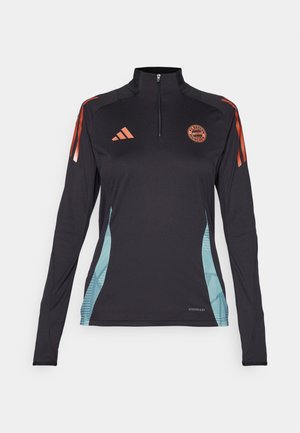 Černé sportovní tričko s dlouhým rukávem a polovičním zipem, oranžové akcenty a modré geometrické postranní panely. Logo Adidas na hrudi. Štítek AEROREADY na spodní části.