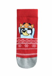 Red sock featuring a cartoon character with a light blue face and orange crown, accented with white snowflake patterns. Gray toe area.