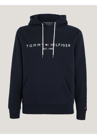 Felpa navy realizzata in morbido cotone con tasca a marsupio, cordini bianchi e logo ricamato "TOMMY HILFIGER" sul petto.