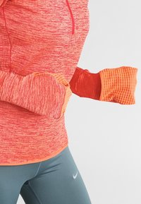 Nike Performance Sport T-shirt - orange