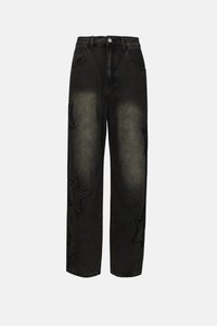 Black denim jeans with a loose fit, featuring faded areas and large star patches on each leg. Classic five-pocket design and button closure.