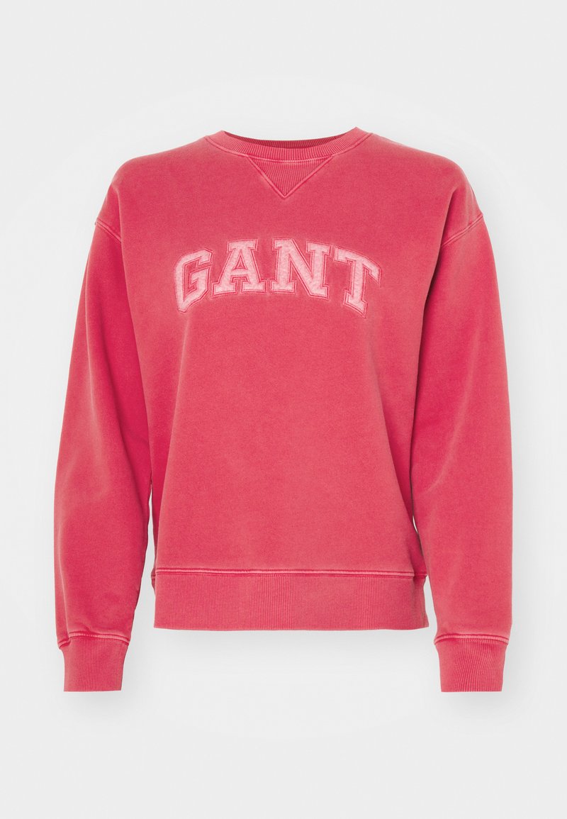 Czerwony sweter z okrągłym dekoltem, wykonany z mieszanki bawełny, z dużymi, haftowanymi literami "GANT" na piersi. Żebrowane mankiety i dół.