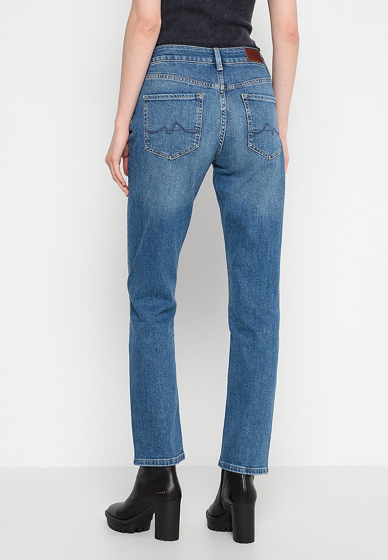 Hoch-taillierte blaue Jeans aus Denim mit geradem Schnitt, ausgestattet mit zwei Gesäßtaschen und einem Lederpatch am Bund. Strukturiertes Stoffdetail.