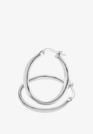Silver-tone metal hoop earrings with a smooth, polished finish. They feature a secure clasp for easy wear and measure approximately 3 inches in diameter.