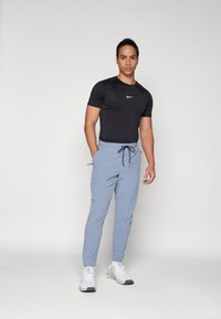 Nike Performance UNLIMITED - Pantalones deportivos - ashen slate/black