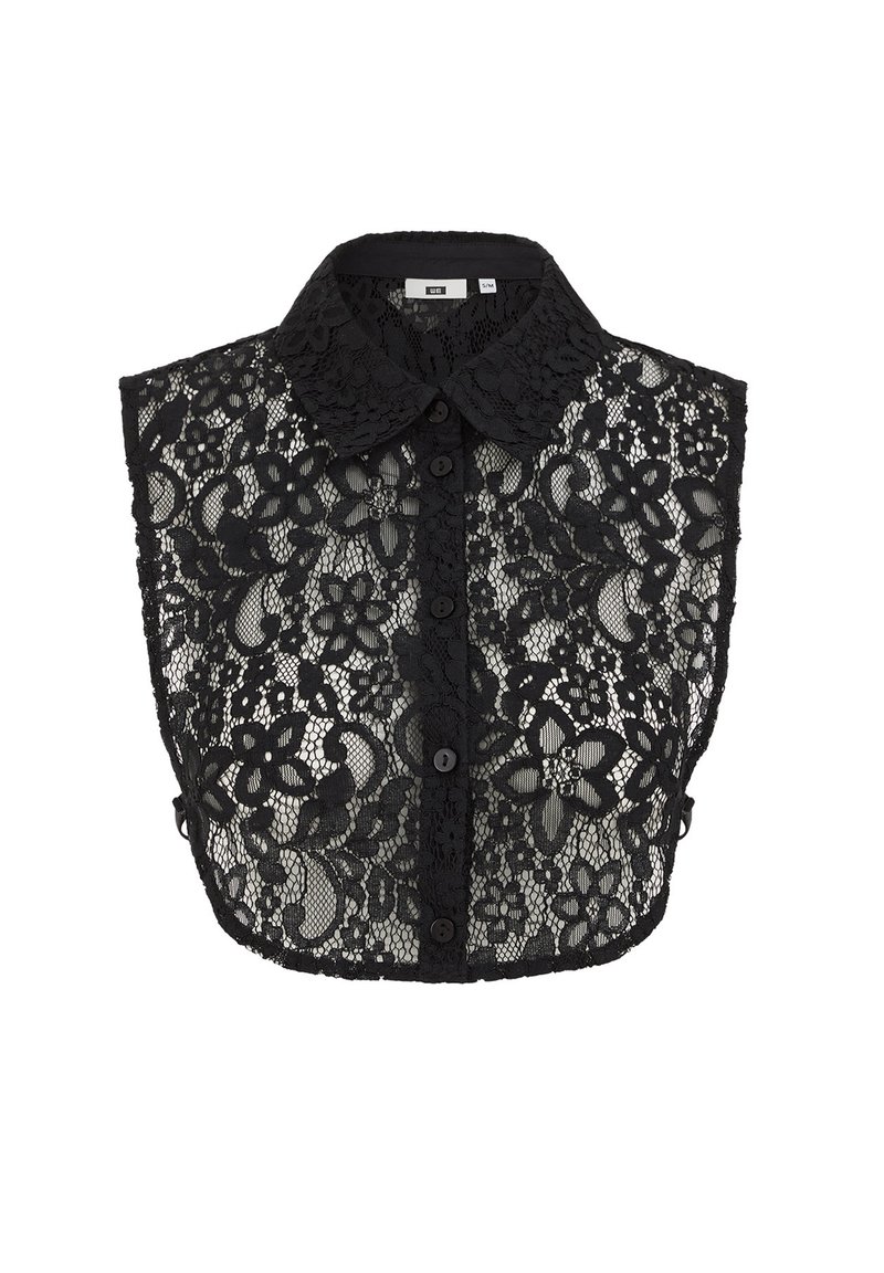 Must mustrippkle pindiga musta pitsist pealikuga, nööpidega eest ja lillemustriga. Läbipaistev kangas, millel on sakilise servaga äär.