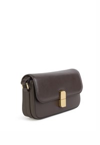 Brown leather shoulder bag with a flap closure, featuring a gold-colored rectangular clasp and side stitching detail. Compact and structured design.