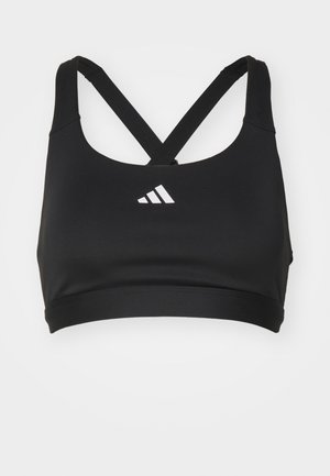 Soutien-gorge de sport noir avec un décolleté rond et des bretelles croisées. Fabriqué en tissu lisse, avec un logo blanc sur le devant.
