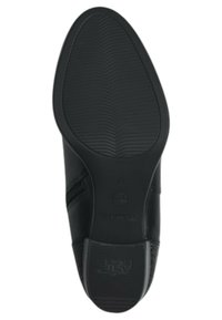 Suela de zapato de cuero negro con una textura y un diseño en el relieve. Presenta una punta redondeada y un detalle de costura lateral. Talla marcada como 37.