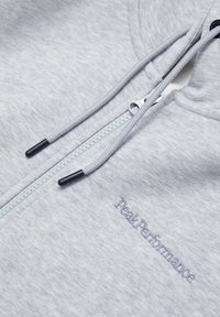 Grauer Zip-Hoodie aus strukturiertem Stoff. Mit verstellbarem Kordelzug an der Kapuze, Reißverschluss und gesticktem "Peak Performance"-Logo auf der linken Seite.