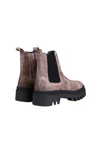 Brown suede ankle boots with elastic side panels and pull tabs. Chunky black rubber soles with a serrated pattern for traction.