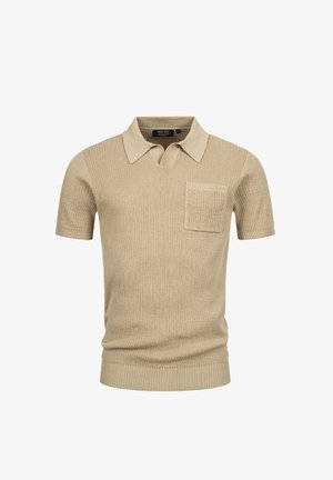Polo shirt beige a manica corta con texture a coste, colletto piatto e una tasca sul petto. Presenta un orlo dritto e un design aderente.