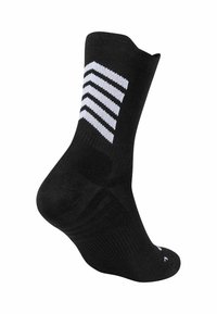 Calza atletica nera con motivo a chevron bianco sul lato, dotata di un bordo a costine e suola imbottita per comfort e supporto.