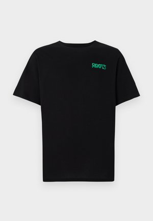 T-shirt noir en coton à manches courtes. Présente un logo "ROOTS" vert sur le devant, un col rond et une coupe standard.