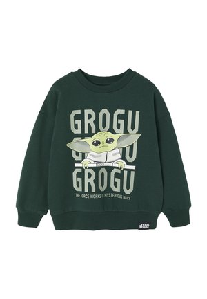 Dark green sweatshirt with a loose fit. Features a graphic of Grogu with text “GROGU” and “THE FORCE WORKS IN MYSTERIOUS WAYS” in light gray.