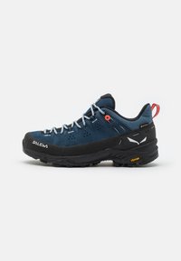 Blue and black hiking shoe with a textured upper, breathable mesh, Vibram sole, and reinforced toe cap. Features a red pull tab and light laces.