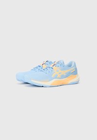 Light blue athletic shoes with perforated upper, orange accents, flat laces, and a textured rubber sole for traction.