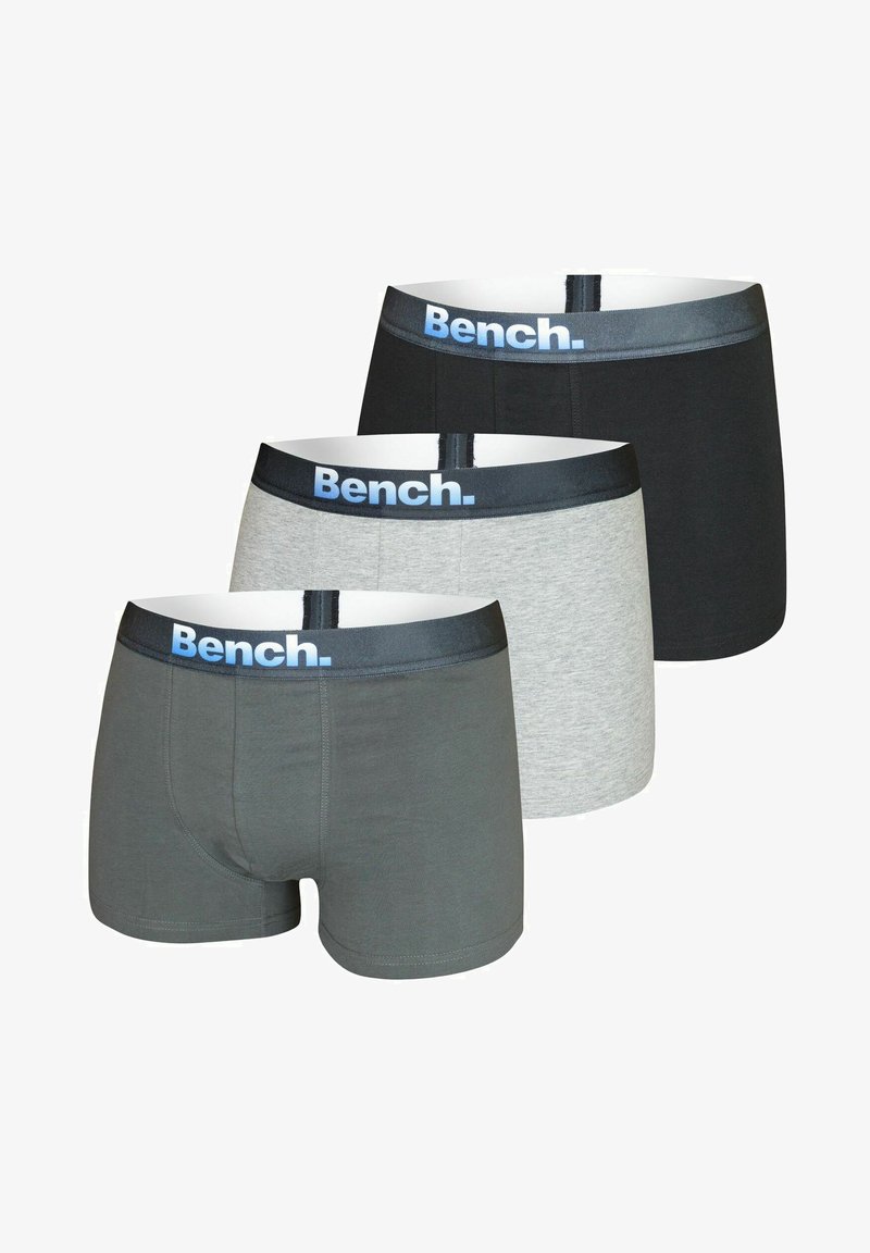 Drei Paare Herren-Boxershorts in Dunkelgrau, Hellgrau und Schwarz, mit einem blauen "Bench."-Logo auf dem elastischen Bund.