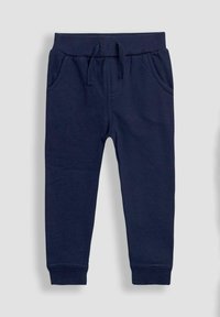 Navy siniset jogger-housut, jotka on valmistettu pehmeästä kankaasta. Niissä on elastinen vyötärö, jossa on naru, sivutaskut ja ribbikuituiset hihnat.