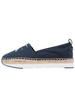 Espadrille bleu marine à enfiler avec semelle intérieure en jute tressée, semelle extérieure en caoutchouc blanc et grand logo blanc sur la partie avant.