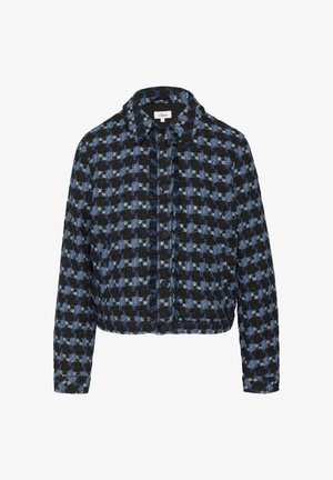 Cropped jacket in black and blue houndstooth pattern. Features a collar and button closure, with textured fabric and frayed edges.