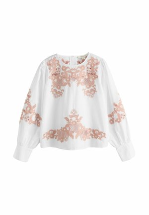 White embroidered blouse featuring pink floral patterns, long sleeves, round neckline, and a button closure at the back.