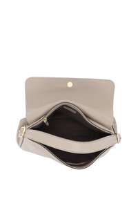 Beige leather handbag with gold hardware, wide opening, and an adjustable strap. Interior features a smooth lining and a zip pocket.